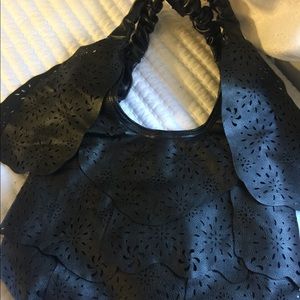 Mellow World  floral patterns cut out of leather